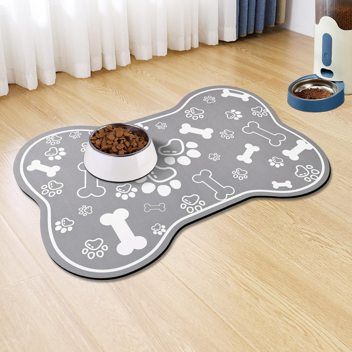 grey bone-shaped mat with a bowl on it